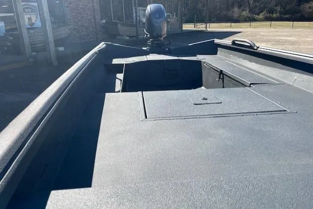 Slide: The Image of 2026 Reaper Boats 656-1882 model, showcasing sleek deck design and outboard motor. - 6