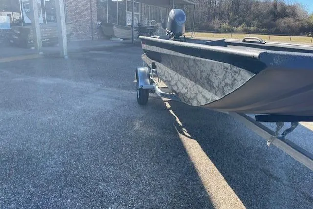 Slide: The Image of 2026 Reaper Boats 656-1882 on trailer, parked outdoors in sunny setting. - 7