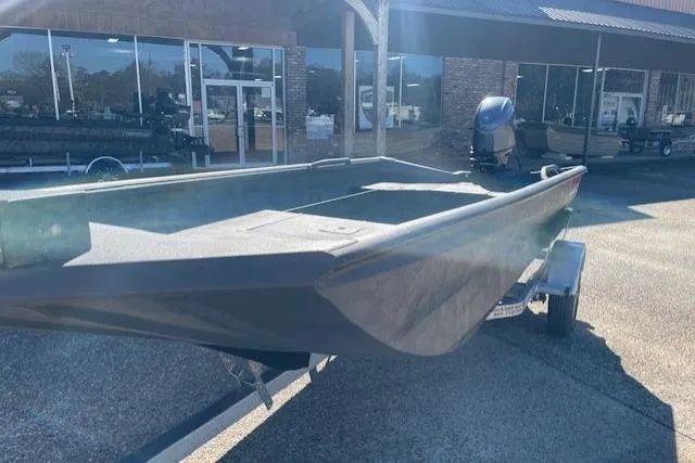 Slide: The Image of 2026 Reaper Boats 656-1882 model on trailer outside dealership. - 9