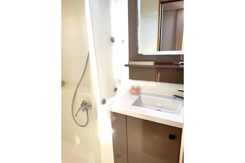 Slide: The Image of Bathroom interior of 2016 Fountaine Pajot Lucia 40 catamaran, featuring sink and shower. - 14