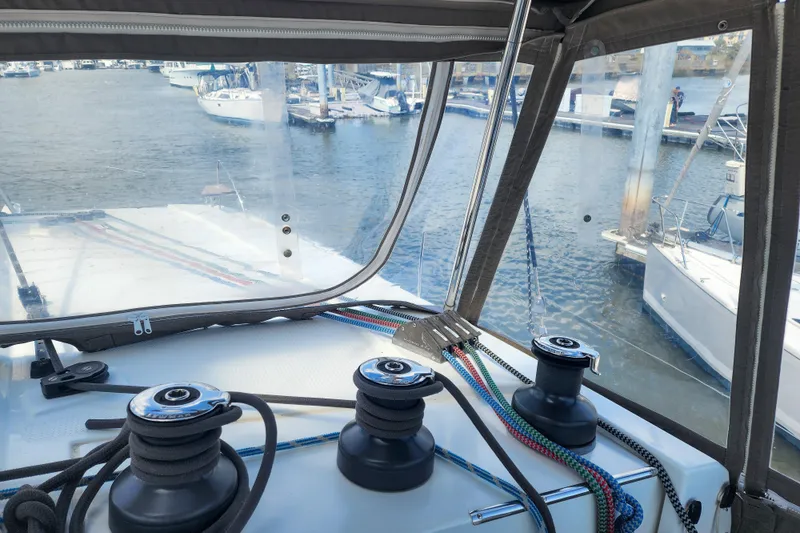 Slide: The Image of 2016 Fountaine Pajot Lucia 40 catamaran interior with marina view through windows. - 24