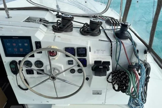 Slide: The Image of Helm of 2016 Fountaine Pajot Lucia 40 catamaran with navigation instruments and ropes. - 3