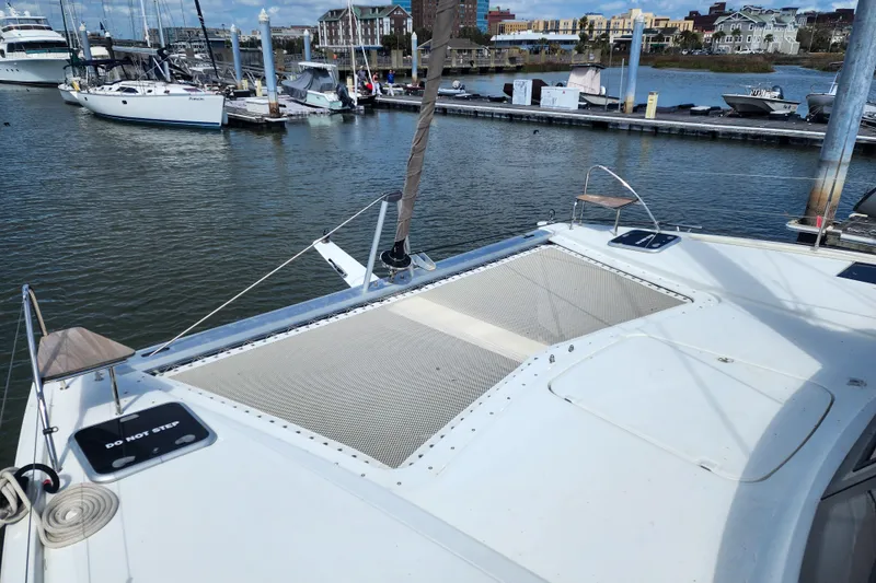 Slide: The Image of 2016 Fountaine Pajot Lucia 40 yacht docked beside wooden pier. - 33