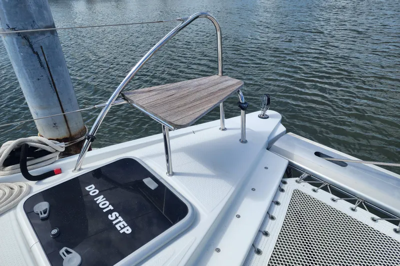 Slide: The Image of 2016 Fountaine Pajot Lucia 40 catamaran deck with sleek design and marina view. - 35