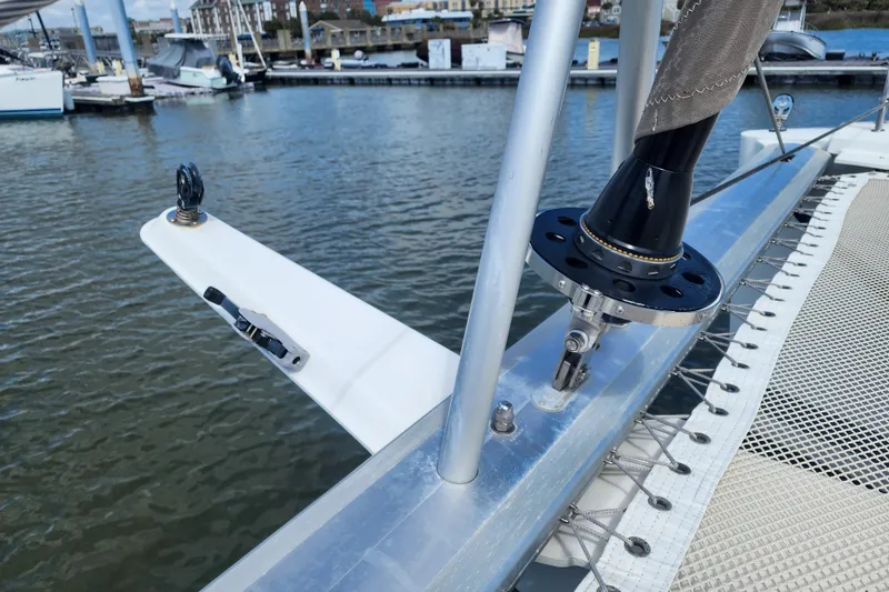 Slide: The Image of 2016 Fountaine Pajot Lucia 40 catamaran docked, featuring "Do Not Step" sign on deck. - 36