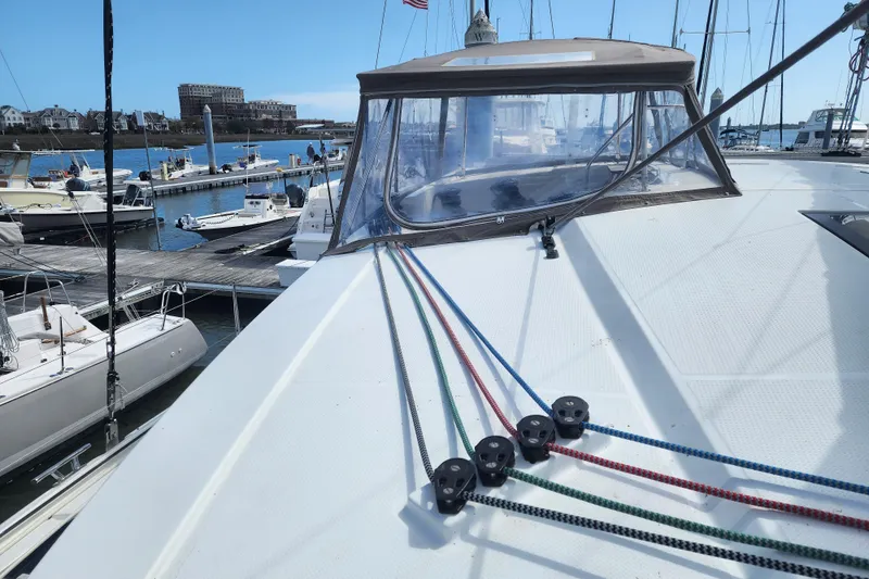 Slide: The Image of Trampoline deck of 2016 Fountaine Pajot Lucia 40 catamaran, docked at marina. - 38