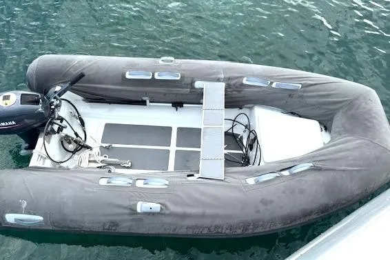 Slide: The Image of Inflatable dinghy with Yamaha motor, docked beside a 2016 Fountaine Pajot Lucia 40. - 4