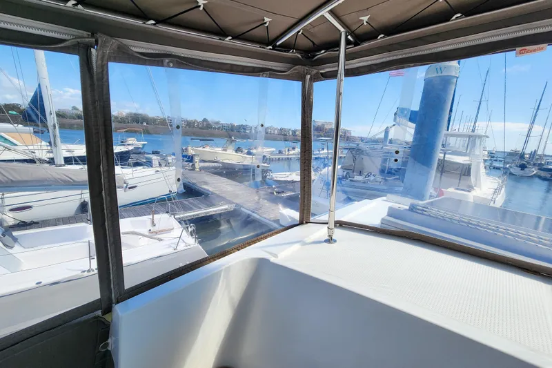 Slide: The Image of 2016 Fountaine Pajot Lucia 40 catamaran deck with large windows and sleek design. - 41