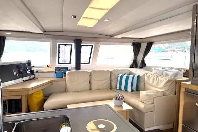 Slide: The Image of 2016 Fountaine Pajot Lucia 40 catamaran docked at marina, showcasing deck and rigging. - 42