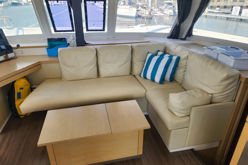 Slide: The Image of 2016 Fountaine Pajot Lucia 40 catamaran with solar panels docked at marina. - 43