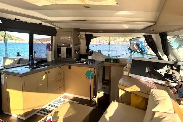Slide: The Image of View from 2016 Fountaine Pajot Lucia 40 catamaran cockpit, overlooking marina with sailboats. - 44