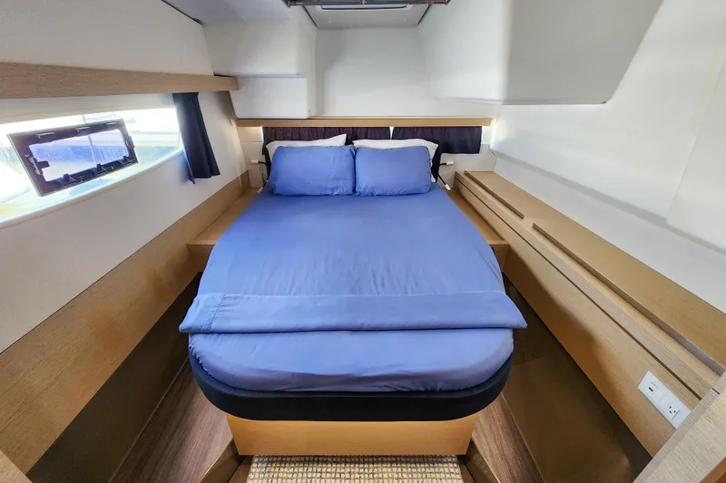 Slide: The Image of Interior view of 2016 Fountaine Pajot Lucia 40 yacht, featuring stairs and cozy cabin space. - 57