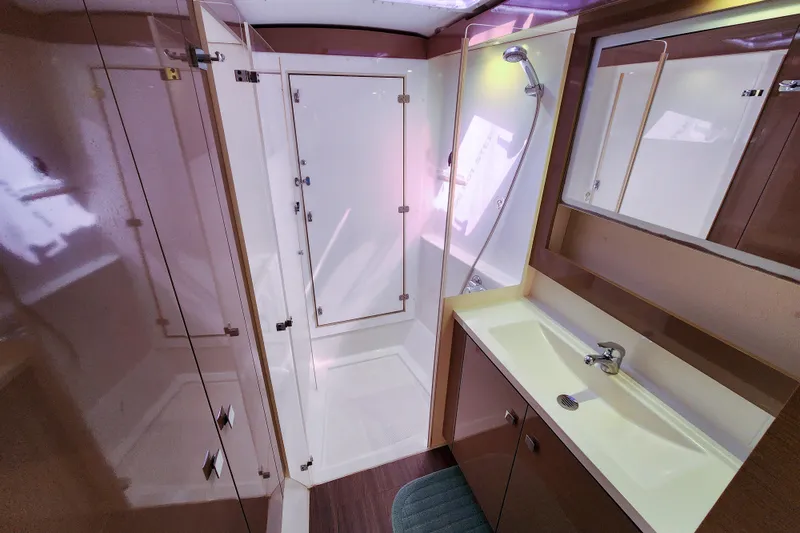 Slide: The Image of Luxurious cabin interior of 2016 Fountaine Pajot Lucia 40 catamaran with cozy bed and modern decor. - 59