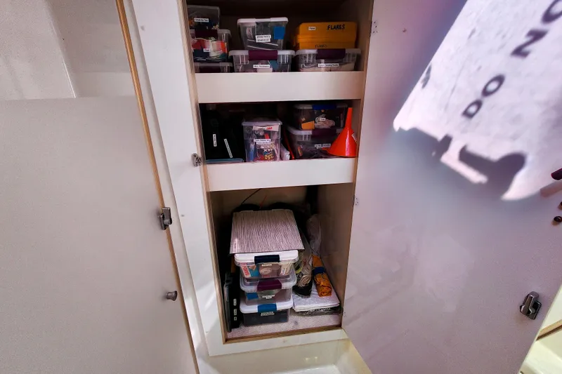 Slide: The Image of Cozy cabin interior of 2016 Fountaine Pajot Lucia 40 with blue bedding and natural light. - 60