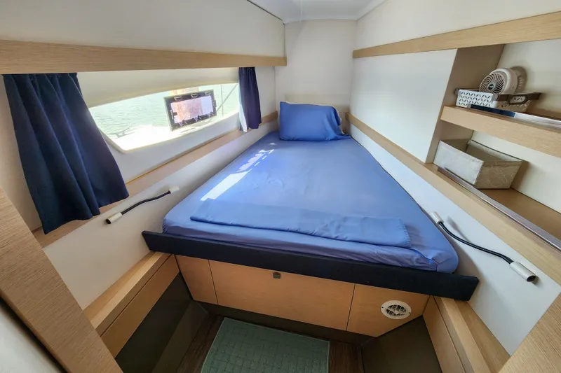 Slide: The Image of Storage cabinet on 2016 Fountaine Pajot Lucia 40 yacht, organized with labeled containers. - 64