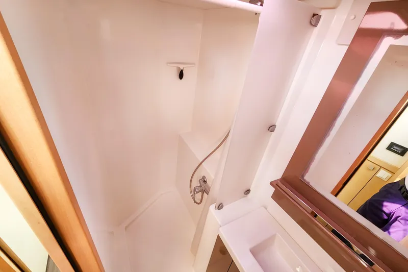 Slide: The Image of Bathroom controls on 2016 Fountaine Pajot Lucia 40 yacht, featuring toilet and instructions. - 65
