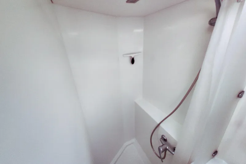 Slide: The Image of Interior of 2016 Fountaine Pajot Lucia 40 catamaran with wooden flooring and modern cabinetry. - 66