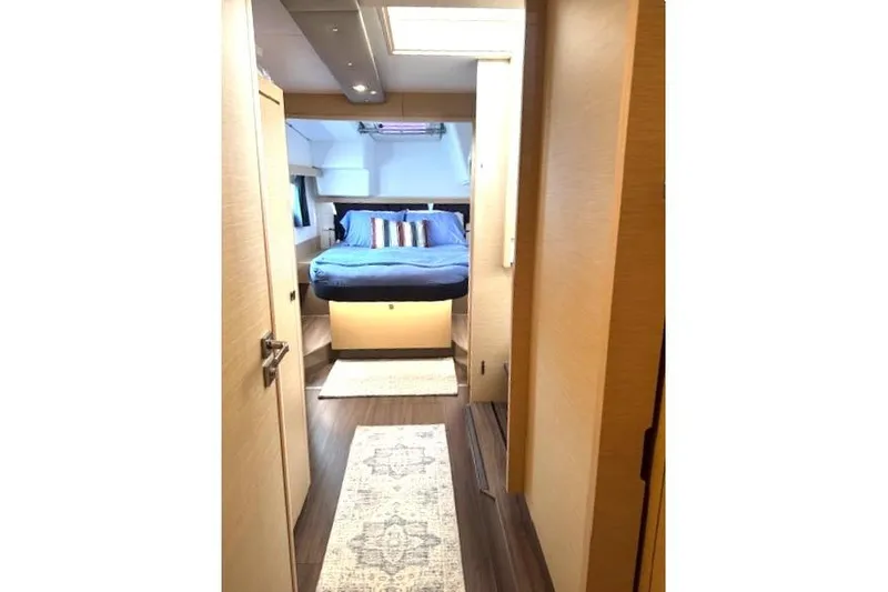 Slide: The Image of Interior of 2016 Fountaine Pajot Lucia 40 catamaran cabin with bed and modern decor. - 7