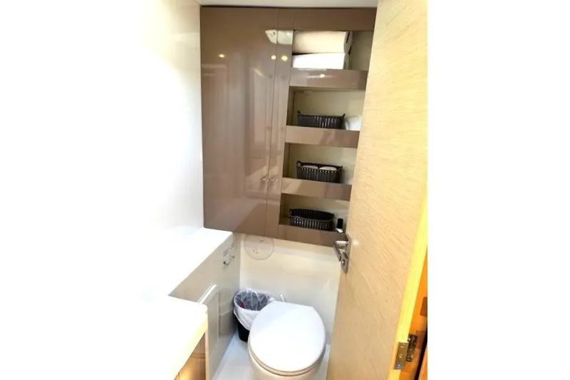 Slide: The Image of Shower area in 2016 Fountaine Pajot Lucia 40 catamaran, featuring sleek white design. - 70