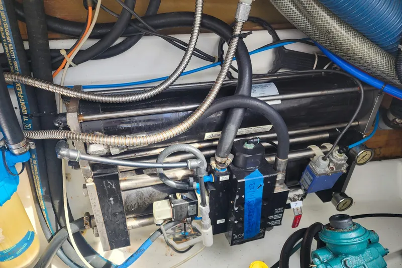 Slide: The Image of Engine room of 2016 Fountaine Pajot Lucia 40 catamaran, showing equipment and wiring. - 78