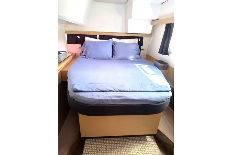 Slide: The Image of 2016 Fountaine Pajot Lucia 40 cabin with cozy bed and modern interior design. - 8