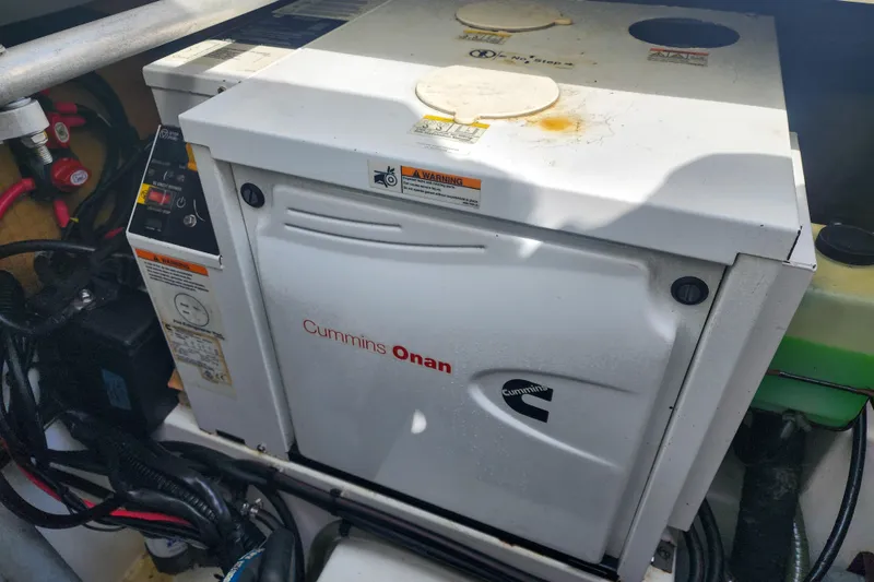 Slide: The Image of Engine compartment of a 2016 Fountaine Pajot Lucia 40 catamaran, showcasing complex piping and machinery. - 82