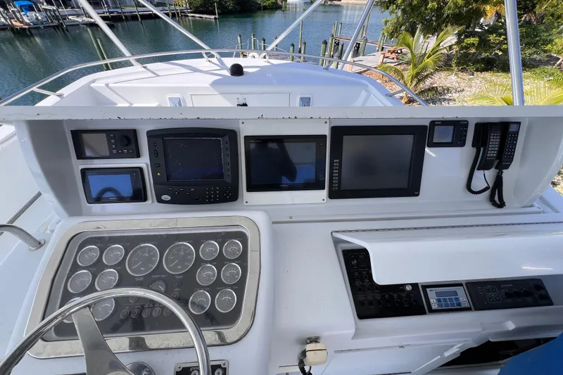 Slide: The Image of Control panel of a 2001 Hatteras 65 Convertible yacht with navigation instruments. - 27