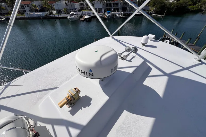 Slide: The Image of Rooftop view of 2001 Hatteras 65 Convertible yacht with Garmin equipment, overlooking marina. - 28