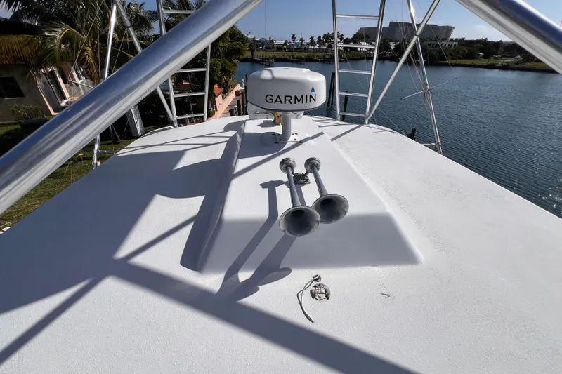 Slide: The Image of Rooftop view of 2001 Hatteras 65 Convertible yacht with Garmin radar and dual horns. - 29