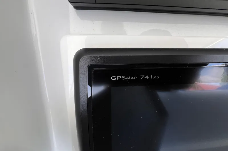 Slide: The Image of GPSMAP 741xs device on 2001 Hatteras 65 Convertible yacht dashboard. - 33