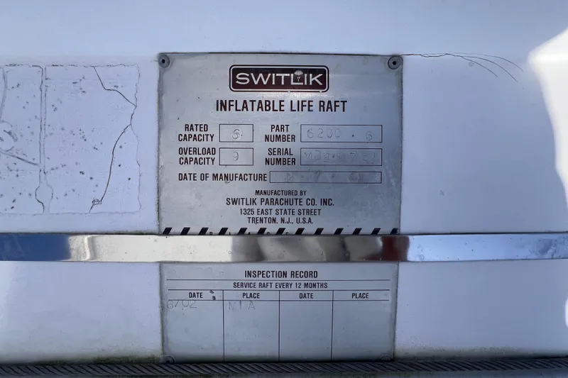 Slide: The Image of Plaque of Switlik inflatable life raft on 2001 Hatteras 65 Convertible yacht. - 34