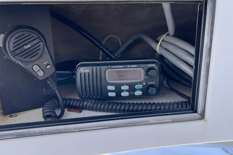 Slide: The Image of VHF marine radio and microphone on 2001 Hatteras 65 Convertible boat. - 35