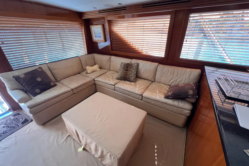 Slide: The Image of Luxurious interior of 2001 Hatteras 65 Convertible yacht with plush seating and elegant decor. - 37