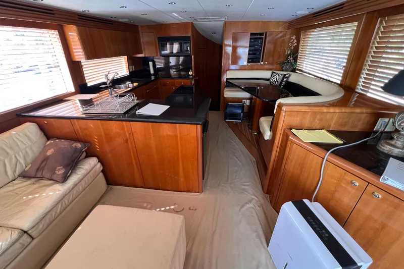 Slide: The Image of Luxurious interior of 2001 Hatteras 65 Convertible yacht with wood finishes and modern amenities. - 39