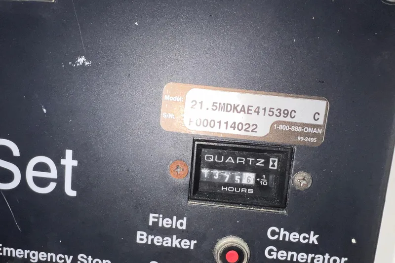 Slide: The Image of Control panel of a 2001 Hatteras 65 Convertible, displaying model and serial numbers. - 69