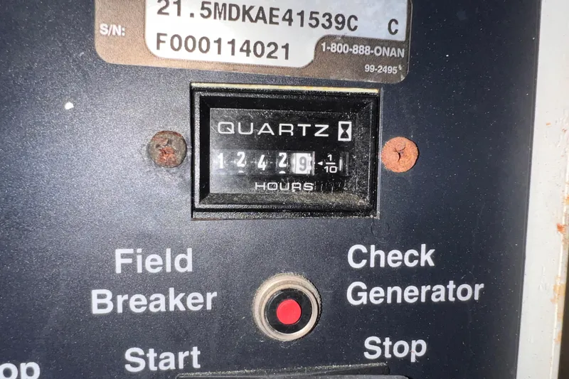 Slide: The Image of Control panel of a 2001 Hatteras 65 Convertible with hour meter reading 12429.9 hours. - 74