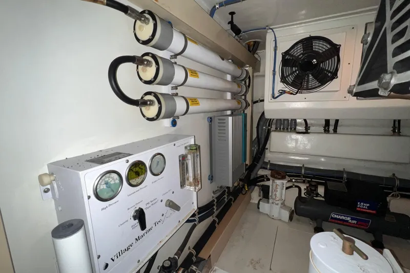 Slide: The Image of Engine room of 2001 Hatteras 65 Convertible yacht with water filtration system. - 79