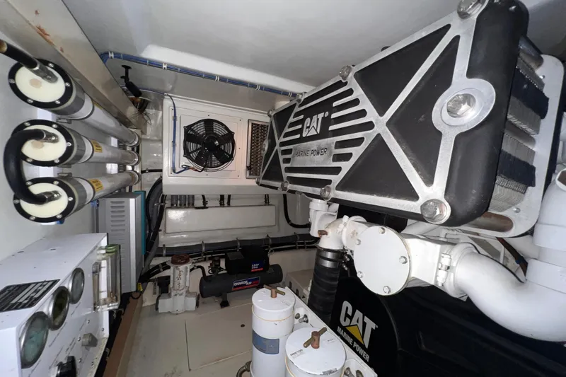 Slide: The Image of Engine room of 2001 Hatteras 65 Convertible with CAT marine power components. - 80