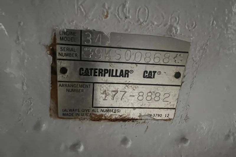Slide: The Image of Caterpillar engine plate on 2001 Hatteras 65 Convertible, showing model and serial numbers. - 97