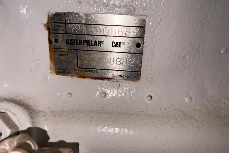 Slide: The Image of Caterpillar engine plate on 2001 Hatteras 65 Convertible, showing model and serial numbers. - 98