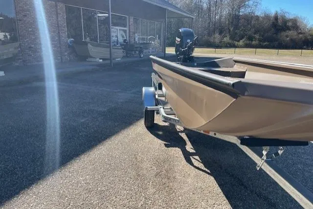 Slide: The Image of 2026 Reaper Boats 550-1880 on trailer, parked outdoors in sunny setting. - 7