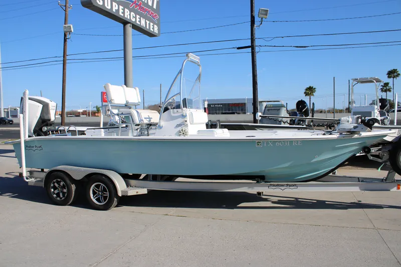 The Image of 2008 Shallow Sport 24 Modified V boat on trailer at marine supercenter. - 1