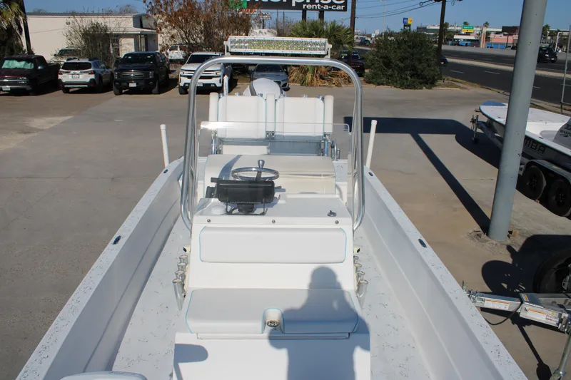 Slide: The Image of 2008 Shallow Sport 24 Modified V boat parked in a lot, front view. - 10