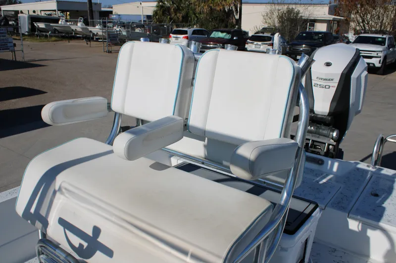 Slide: The Image of 2008 Shallow Sport 24 Modified V boat with dual white seats and Evinrude 250 HP engine. - 12