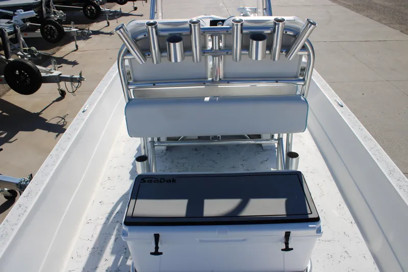Slide: The Image of 2008 Shallow Sport 24 Modified V boat interior with rod holders and SeaDek cooler. - 13