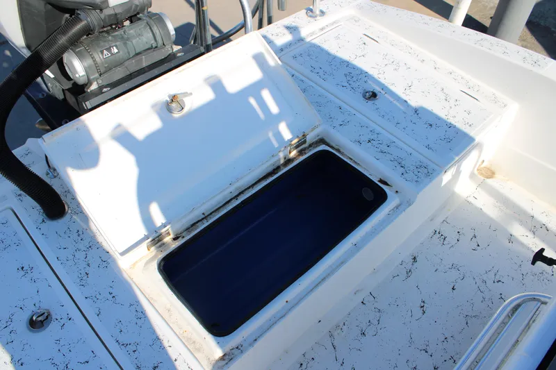 Slide: The Image of 2008 Shallow Sport 24 Modified V boat with open storage compartment. - 14