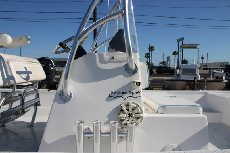 Slide: The Image of 2008 Shallow Sport 24 Modified V boat console with seating and rod holders. - 15