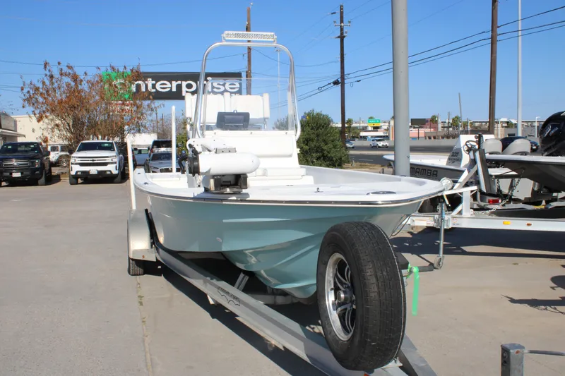 Slide: The Image of 2008 Shallow Sport 24 Modified V boat on trailer in parking lot. - 19