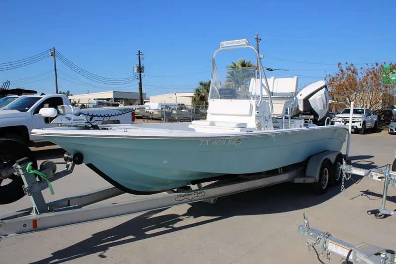 Slide: The Image of 2008 Shallow Sport 24 Modified V boat on trailer in outdoor setting. - 20