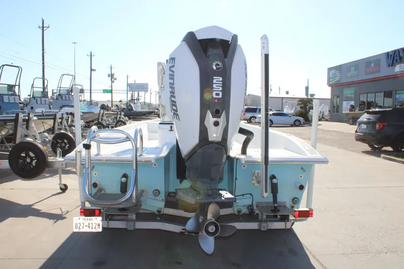 Slide: The Image of 2008 Shallow Sport 24 Modified V boat with Evinrude engine at dealership. - 3